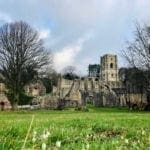 The Abbey littered with White Blooms