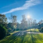 Sunny autumn day over a holiday park with caravans and trees