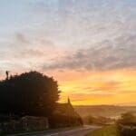 Scenic countryside road at sunrise