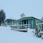Snow-covered cabins at the park.