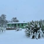 Snow-covered cabin in the winter.