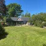 Rolling green hills, spring blossoms.