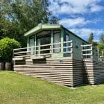Holiday home with a wooden deck at Warren Forest Park