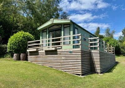 Holiday home with a wooden deck at Warren Forest Park