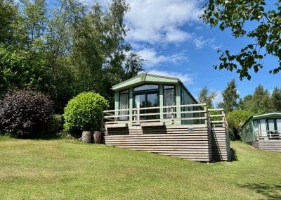 Holiday home with a wooden deck at Warren Forest Park