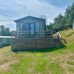 Holiday lodge with a wooden deck at Warren Forest Park