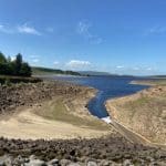 Grimwith Reservoir with a clear blue sky
