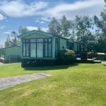Holiday home with a deck at Warren Forest Park