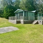 Holiday home with a wooden deck at Warren Forest Park