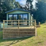 Modern caravan with a spacious deck at Warren Forest Park