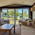 Spacious lounge area in a caravan at Warren Forest Park